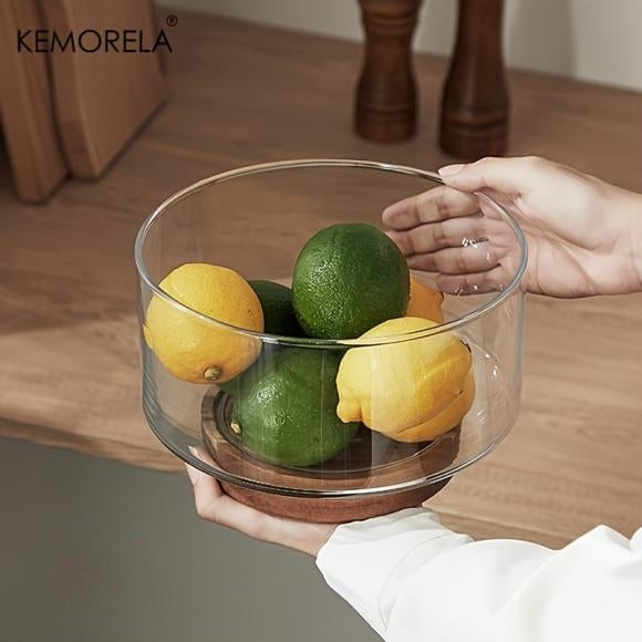 Glass fruit bowl with a wooden base