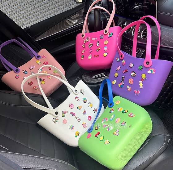 Crocs Classic Tote waterproof bags with Jibbitz charms attached